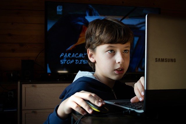 playing on laptop